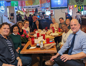 Park Study Tour attendees posing at a large restaurant table