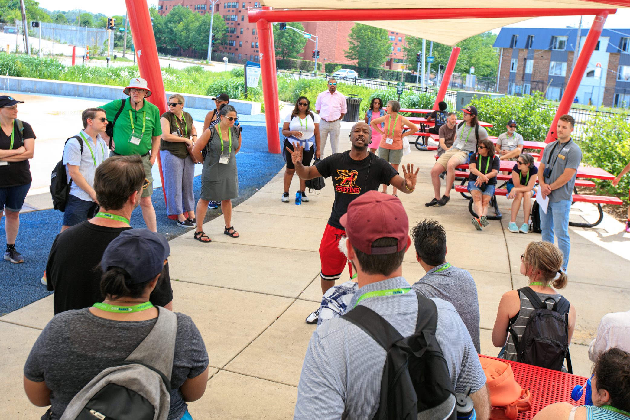 Wellston Mayor Nathaniel Griffin speaks to St. Louis Park Tour at Trojan Park