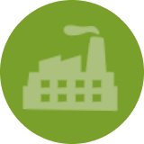 A green icon of a factory