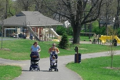 Women walking in a park with strollers