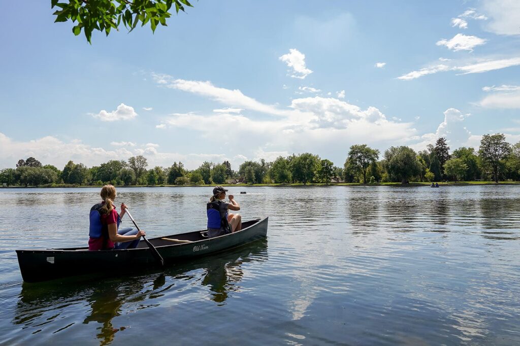Two women kayaking on a river