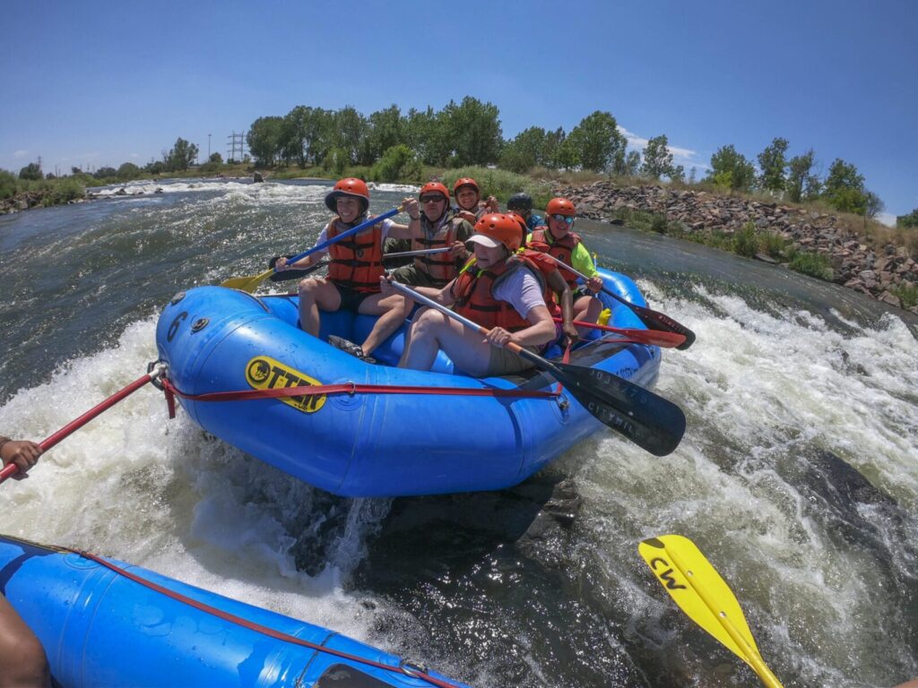 A group white water rafting down a river