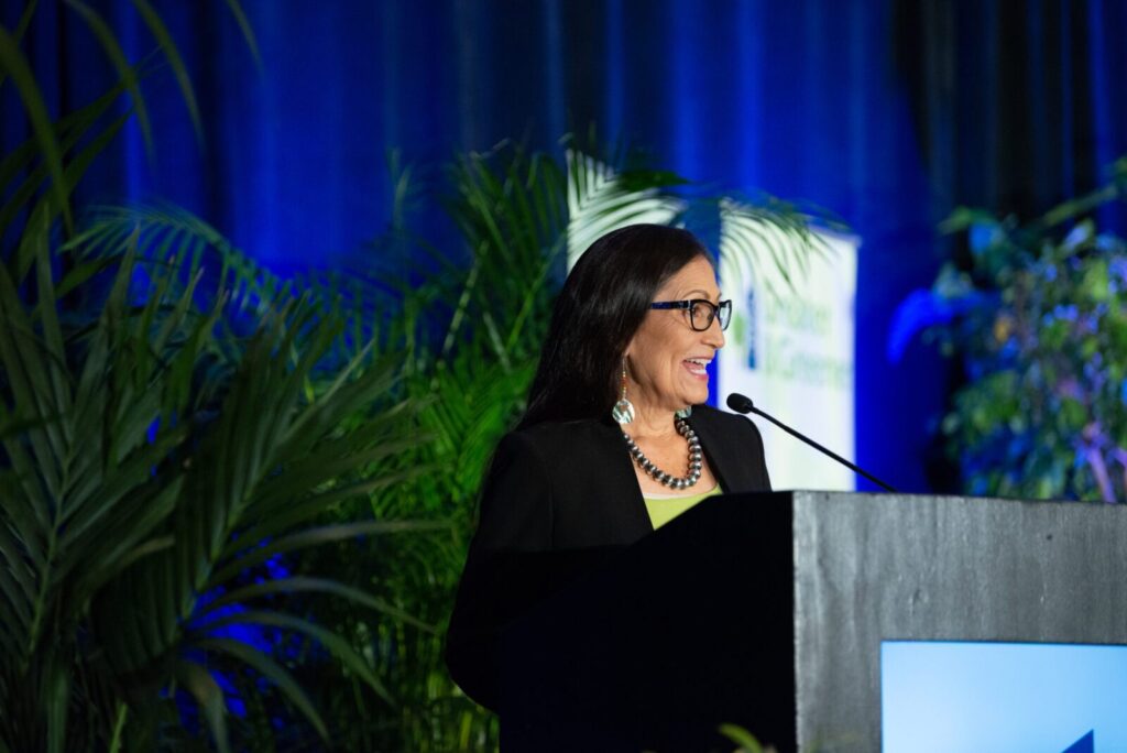 A woman speaking at a podium