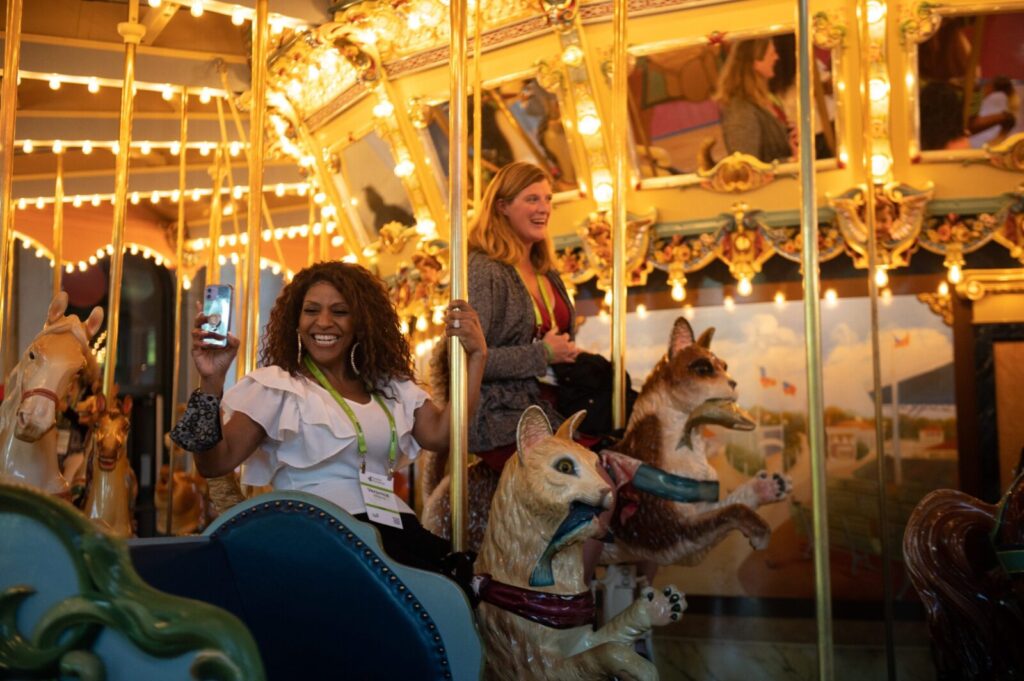 Two women on a carousel