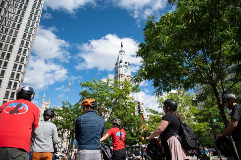A group on Segways looking at the Philadelphia Clock Tower