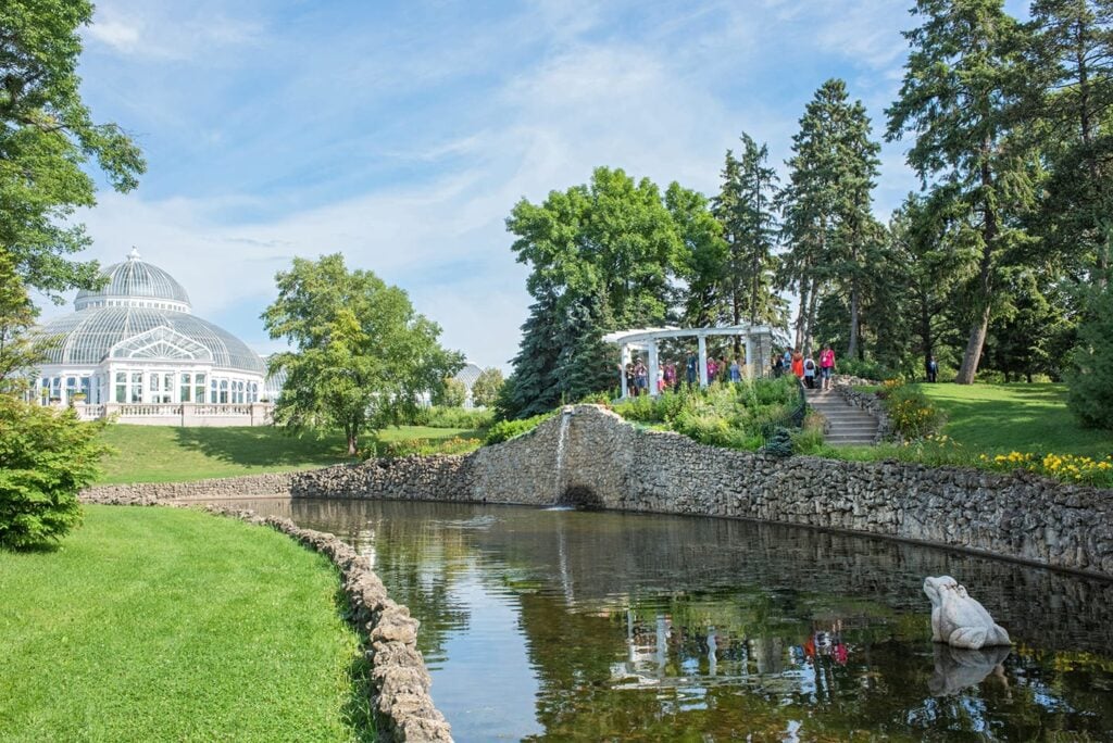 A group of people in an outdoor botanical garden