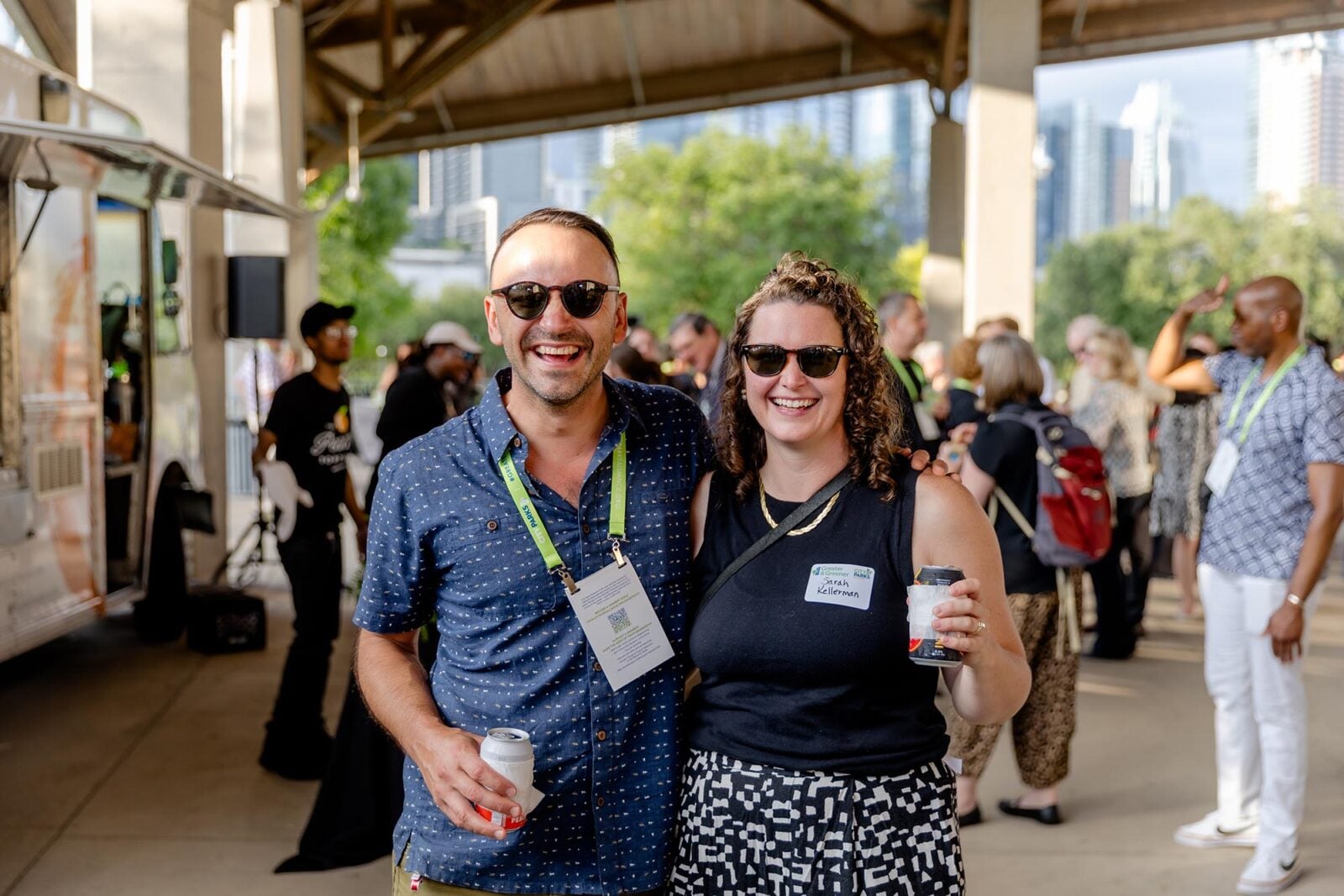 Two Greater & Greener attendees smiling at an outdoor reception