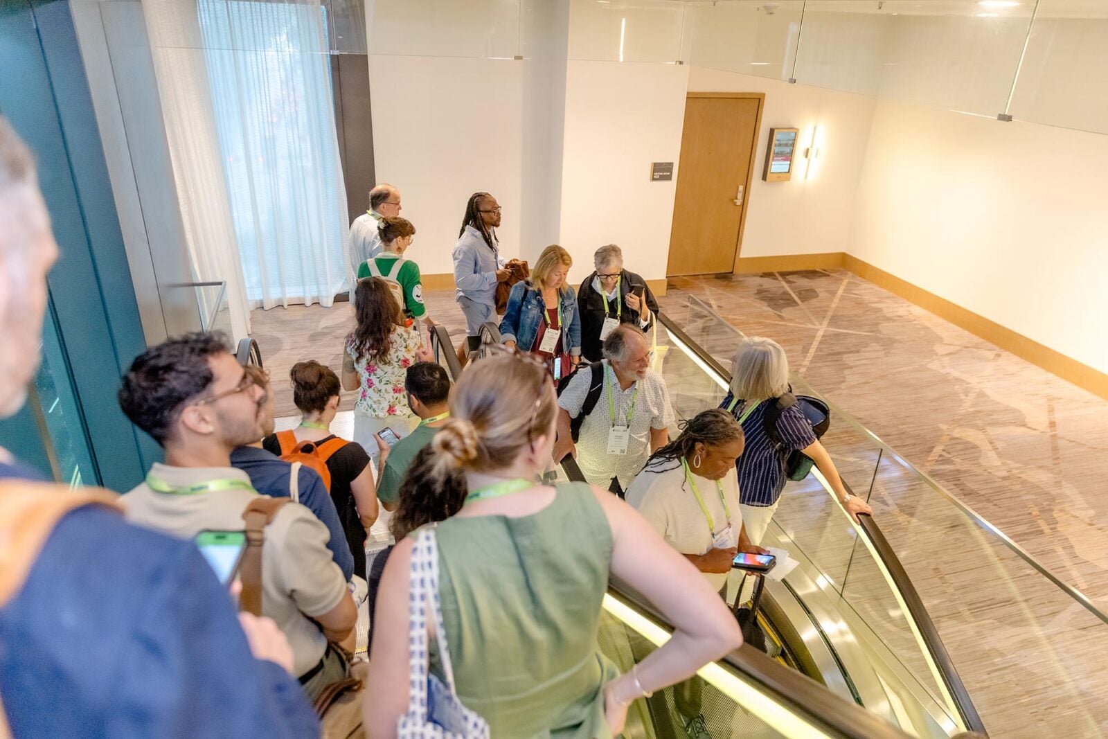 Greater & Greener participants going down an escalator