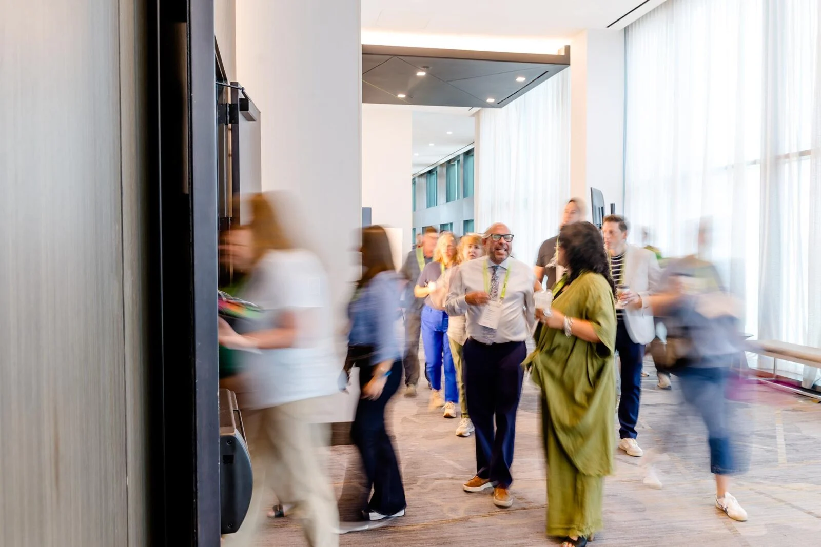 People walking into a conference room
