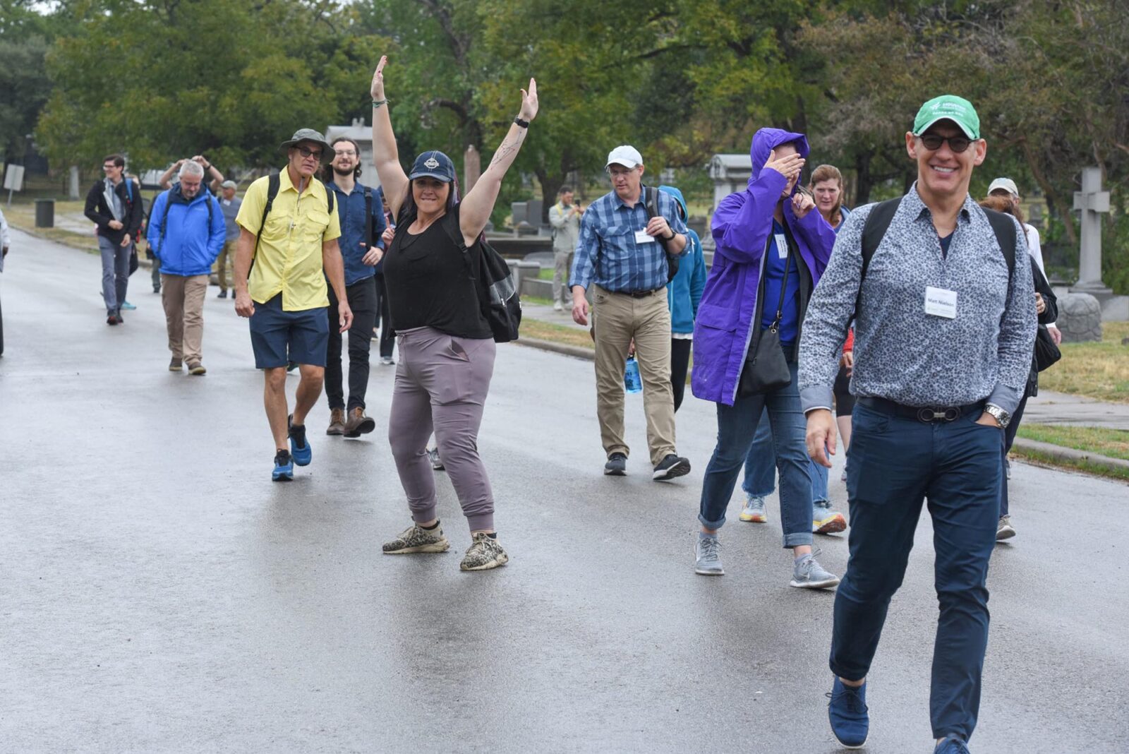 Park Study Tour attendees walking and posing on a driveway