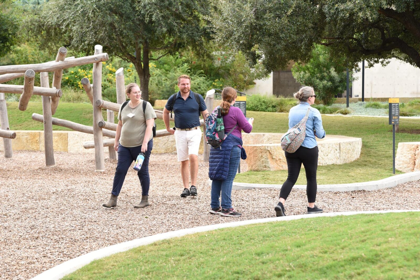 Park Study Tour attendees looking at a natural playground