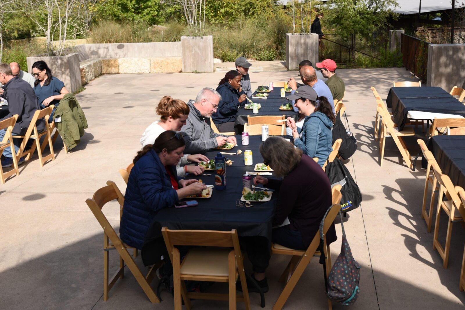A group of people eating at long tables