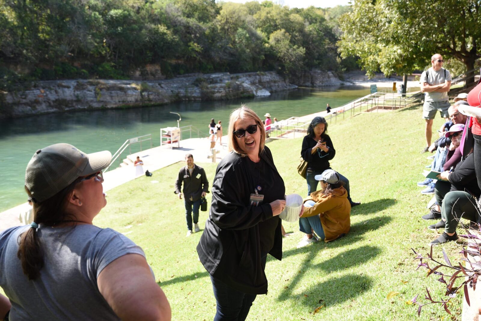 People chatting on the Barton Springs lawn