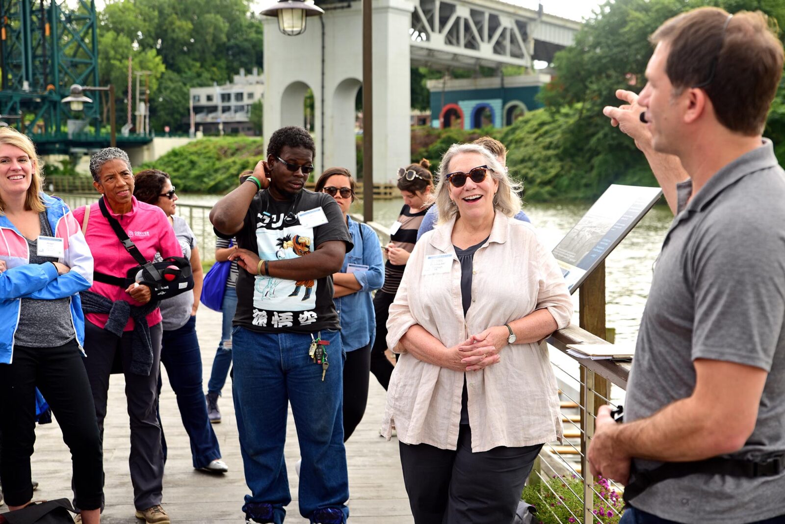 Park Study Tour attendees listening to a tour leader at a waterfront
