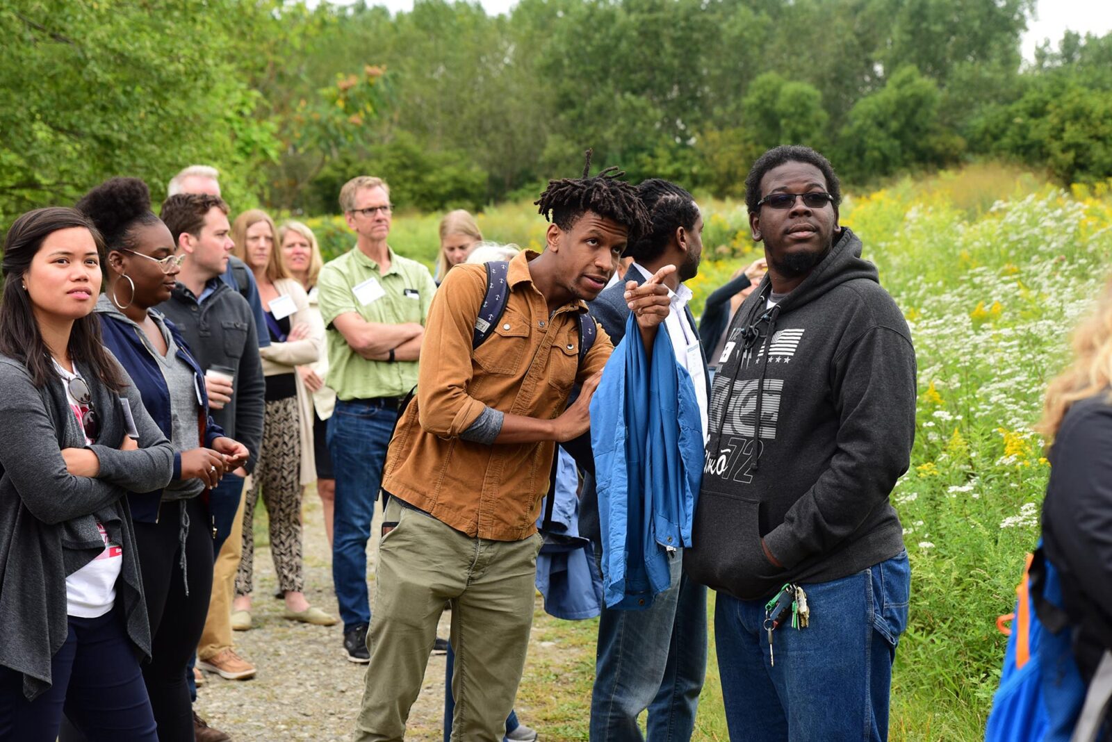 Park Study Tour attendees observing in a field