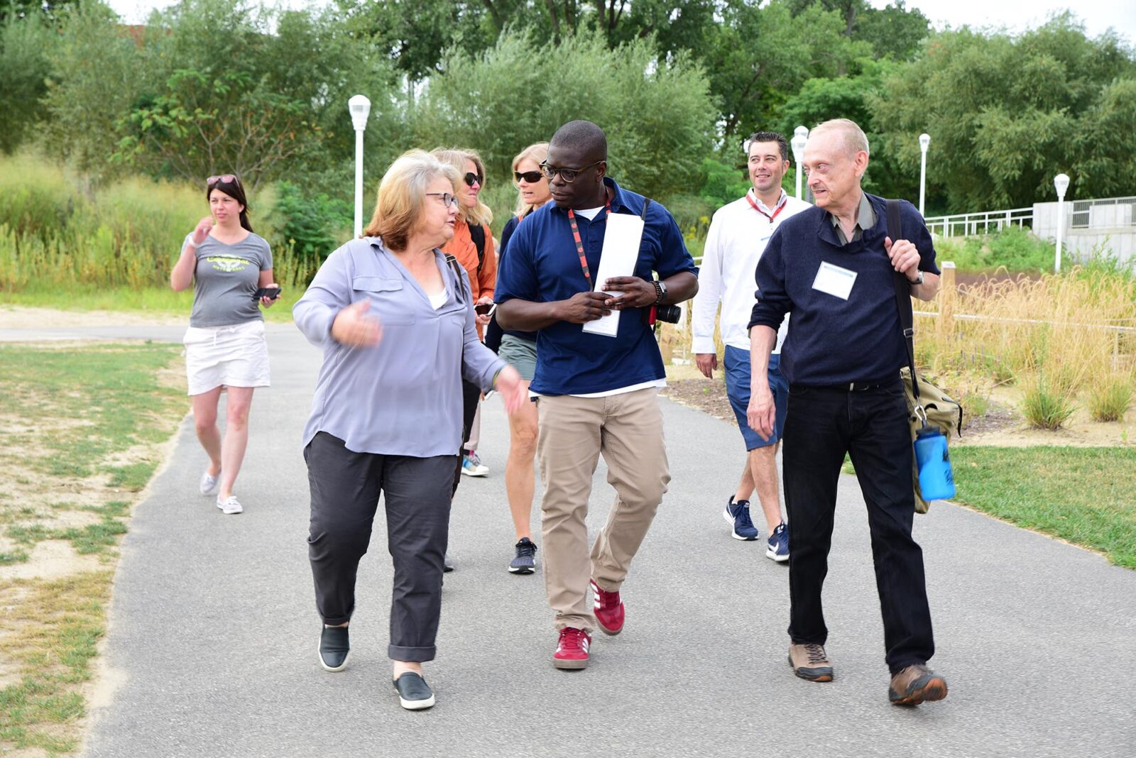 Park Study Tour attendees in conversation in a park