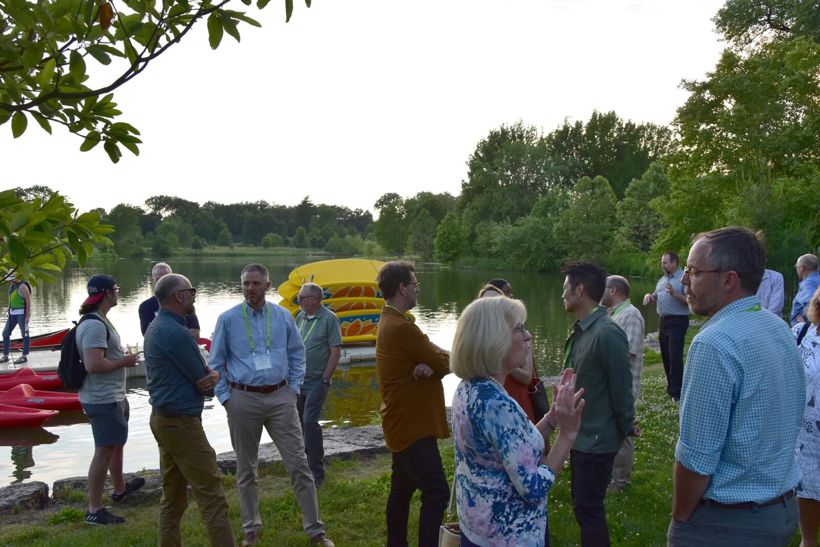 Park Study Tour attendees in conversation in a waterfront park