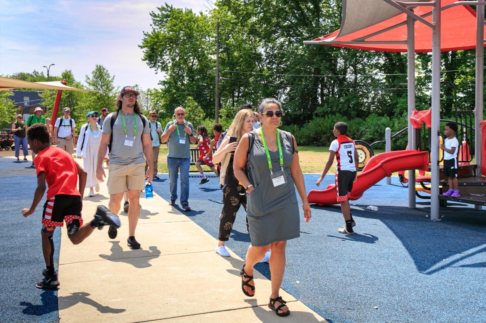 Park Study Tour attendees walking through a playground